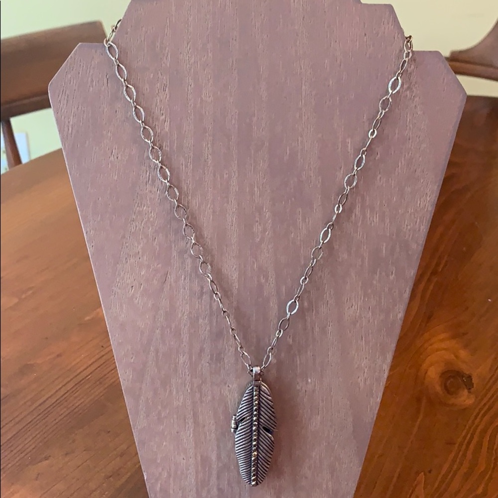 Lucky Brand brass tone feather locket